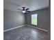 Neutral bedroom with a ceiling fan, and a window at 5320 Sw 128Th Pl, Ocala, FL 34473
