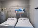 Laundry room with washer, dryer, water heater, and wire shelves at 5320 Sw 128Th Pl, Ocala, FL 34473