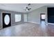Inviting living room with tile floors, neutral walls, and plenty of natural light at 5320 Sw 128Th Pl, Ocala, FL 34473