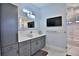 Bathroom features a sleek vanity with modern sink and fixtures, and a glass-enclosed shower at 5845 Sw 43Rd Street Rd, Ocala, FL 34474