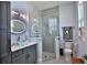 Bright bathroom showcases a sleek glass shower, a decorative mirror, and stylish vanity at 5845 Sw 43Rd Street Rd, Ocala, FL 34474