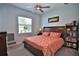 Bedroom with neutral paint, ceiling fan, window, wood furniture, and a comfortable bed at 5845 Sw 43Rd Street Rd, Ocala, FL 34474