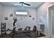 Bright exercise room has motivational wall art, rubber flooring, and an elliptical machine at 5845 Sw 43Rd Street Rd, Ocala, FL 34474