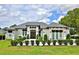 Stunning home featuring a manicured lawn, detailed trim, and an inviting front entrance at 5845 Sw 43Rd Street Rd, Ocala, FL 34474