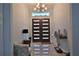 Inviting foyer with double doors, modern lighting, tiled floor, accent furniture, and lots of natural light at 5845 Sw 43Rd Street Rd, Ocala, FL 34474