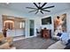 Bright living room featuring a wet bar, sliding glass doors to the lanai, and comfortable seating at 5845 Sw 43Rd Street Rd, Ocala, FL 34474