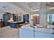 Spacious living area featuring a modern kitchen with a center island and bar stool seating at 5845 Sw 43Rd Street Rd, Ocala, FL 34474