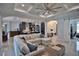 Inviting living room with an open floor plan, modern kitchen, and cozy seating arrangement at 5845 Sw 43Rd Street Rd, Ocala, FL 34474