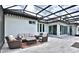 Covered patio featuring comfortable seating, a coffee table, and easy access to indoor living spaces at 5845 Sw 43Rd Street Rd, Ocala, FL 34474