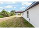 The backyard provides the perfect private outdoor space and includes a covered patio and landscaping at 6240 Cherry Rd, Ocala, FL 34472