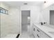 This bathroom features a dual sink vanity with modern fixtures and an open doorway to the main bedroom at 6240 Cherry Rd, Ocala, FL 34472