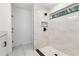 Sleek, tiled shower in a modern bathroom with marble floors at 6240 Cherry Rd, Ocala, FL 34472