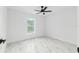 Bright, empty bedroom with white walls and marble floors, perfect for customization at 6240 Cherry Rd, Ocala, FL 34472