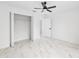 Bedroom featuring walk-in closet, bright white walls, and stylish marble floors at 6240 Cherry Rd, Ocala, FL 34472