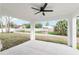 Covered patio with ceiling fan offers views of the backyard, perfect for outdoor living and entertaining at 6240 Cherry Rd, Ocala, FL 34472