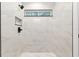 New bathroom features a modern shower with sleek, marbled tile, a shower niche, and a modern shower head at 6240 Cherry Rd, Ocala, FL 34472