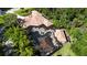 Expansive home with a screened-in pool area, providing a private and luxurious outdoor living space at 695 Se 47Th Loop, Ocala, FL 34480