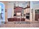Spacious kitchen with custom cabinets, stainless steel appliances, and granite countertops at 695 Se 47Th Loop, Ocala, FL 34480
