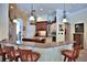 Spacious kitchen with stainless steel appliances, granite countertops and island with seating at 695 Se 47Th Loop, Ocala, FL 34480