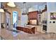 Spacious kitchen with custom cabinets, stainless steel appliances, and granite countertops at 695 Se 47Th Loop, Ocala, FL 34480