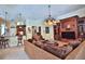 Spacious living room featuring a built-in entertainment center, comfortable seating, and views of the outdoor area at 695 Se 47Th Loop, Ocala, FL 34480