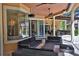 Inviting outdoor patio space with modern furniture and a ceiling fan at 695 Se 47Th Loop, Ocala, FL 34480