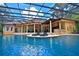 Relaxing outdoor pool area with lounging chairs and sun deck at 695 Se 47Th Loop, Ocala, FL 34480
