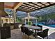 Outdoor kitchen and dining area next to a refreshing pool at 695 Se 47Th Loop, Ocala, FL 34480