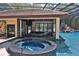 Stunning outdoor pool bar and spa with retractable windows offering seamless access and views at 695 Se 47Th Loop, Ocala, FL 34480
