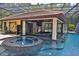 Beautiful view of the outdoor bar and pool with slide feature at 695 Se 47Th Loop, Ocala, FL 34480