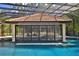 Incredible pool bar with custom accents and covered patio at 695 Se 47Th Loop, Ocala, FL 34480