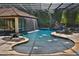 Amazing backyard pool with waterside, waterfall and water features with lush landscaping at 695 Se 47Th Loop, Ocala, FL 34480