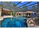 Sprawling backyard with custom swimming pool, waterside, sundeck and lush landscaping at 695 Se 47Th Loop, Ocala, FL 34480
