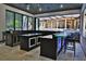 A stunning outdoor bar area with views of the pool and backyard provides a perfect space for entertaining at 695 Se 47Th Loop, Ocala, FL 34480