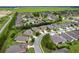 Scenic aerial view of a well-planned community with neatly arranged homes and green spaces at 7839 Sw 97Th Cir, Ocala, FL 34481