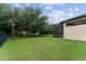Expansive backyard with well-maintained lawn and screened-in patio for comfortable outdoor living and entertaining at 7839 Sw 97Th Cir, Ocala, FL 34481