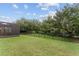 Lush backyard with a screened patio and mature trees providing shade and privacy, ideal for outdoor relaxation at 7839 Sw 97Th Cir, Ocala, FL 34481