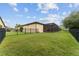 Beautiful backyard with a screened patio, manicured lawn, and perimeter fence, perfect for outdoor enjoyment at 7839 Sw 97Th Cir, Ocala, FL 34481