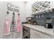 Bar area with wine storage, granite countertop and stone backsplash at 7839 Sw 97Th Cir, Ocala, FL 34481