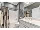Well-lit bathroom featuring a shower-tub combo, marble countertop, and vanity with white cabinets at 7839 Sw 97Th Cir, Ocala, FL 34481
