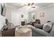 Cozy bedroom featuring a ceiling fan, a sitting area, and neutral paint colors at 7839 Sw 97Th Cir, Ocala, FL 34481