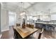 Open dining area that transitions to a modern kitchen with a spacious island and bar seating at 7839 Sw 97Th Cir, Ocala, FL 34481