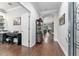 Inviting foyer with hardwood floors, arched doorways, and views of the living spaces at 7839 Sw 97Th Cir, Ocala, FL 34481