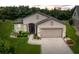 Charming single-story home featuring a manicured lawn, paver driveway, and neutral stucco exterior at 7839 Sw 97Th Cir, Ocala, FL 34481