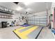 Clean and organized two-car garage with ample storage, and a vibrant floor, suitable for various needs at 7839 Sw 97Th Cir, Ocala, FL 34481