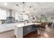 Open kitchen featuring a large island with bar seating and stainless steel appliances at 7839 Sw 97Th Cir, Ocala, FL 34481