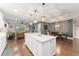 Bright, open-concept kitchen with an island connecting to the living and dining areas at 7839 Sw 97Th Cir, Ocala, FL 34481