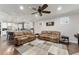 Open-concept living room with stylish furnishings, connecting seamlessly to the kitchen area at 7839 Sw 97Th Cir, Ocala, FL 34481