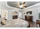 Spacious main bedroom with stylish decor, dresser, and large windows providing natural light at 7839 Sw 97Th Cir, Ocala, FL 34481