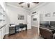 Spacious home office featuring hardwood floors, a ceiling fan, and a functional layout at 7839 Sw 97Th Cir, Ocala, FL 34481